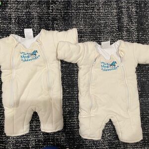 Two small baby Merlin’s Magic Sleepsuits